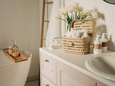 Woven storage baskets on a small bathroom vanity