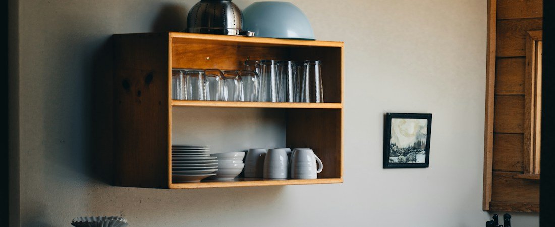 Compact kitchen with clear counters and practical storage