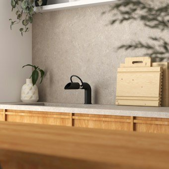 Organized household items grouped together on shelves